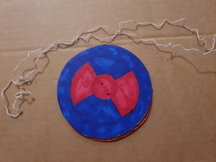 spinner with holes and string